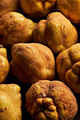 Top view of fresh whole sour yellow lemons on wooden background