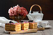 Delicious traditional Turron de Dona Pepa dessert with colorful dragee served on plate on table