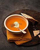 Delicious plates of creamy pumpkin soup seen from above