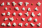 Closeup of some popcorn on a red background