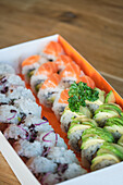 Stock photo of varied sushi box ready to deliver in japanese restaurant.