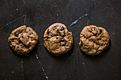 From above homemade chocolate chips cookies on dark background