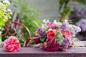 Bouquet of lilac (Syringa Vulgaris), rose (Rosa) 'Fräulein Maria', rose Chippendale, wild garlic flowers and woodruff