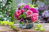 Flower arrangement of lilac (Syringa Vulgaris), rose (Rosa) 'Fräulein Maria', rose Chippendale, Akebie (Akebia)