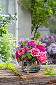 Flower arrangement of lilac (Syringa Vulgaris), rose (Rosa) 'Fräulein Maria', rose Chippendale, Akebie (Akebia)