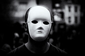 Anonymous person wearing white mask
