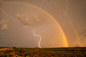 Thunderstorm with double rainbow and lightning, Arizona, USA