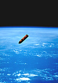 Discarded Space Shuttle external tank, illustration