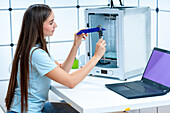 Scientist using 3D printer