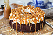 Chocolate wreath cake with salted pretzels and caramel
