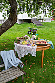 Cake buffet in the garden under the fruit tree