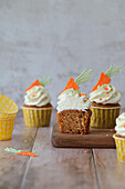 Carrot cupcakes with cream cheese and candied orange zest