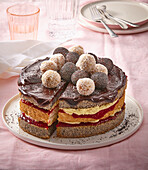 Coconut and poppy seed cake with berry jam