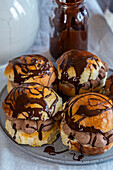 Sweet buns with chocolate cream filling and chocolate icing