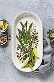 Green asparagus with goat's cheese, walnuts and herbs