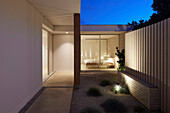 Modern designed patio with lighting and view into the bedroom