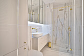 Modern bathroom with glass shower and marbled walls in Warsaw