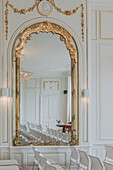 Golden mirror and stucco decoration in baroque style in a registry office