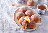Apple and yeast dough balls with icing sugar