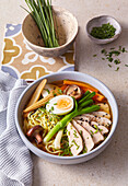 Ramen soup with turkey, vegetables and egg