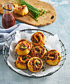 Piquant pork rolls with BBQ sauce and herbs