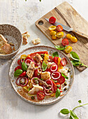 Panzanella salad with grilled peppers and anchovies