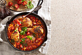 Chicken thighs in lentil and tomato sauce with herbs