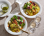 Spaghetti with kale pesto, walnuts and bacon