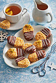 Coconut macaroon sandwich biscuits with chocolate icing