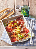 Baked pork chops with bacon and tomatoes