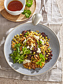 Lentil and rice salad with peas, nuts and feta cheese