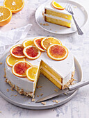 Orange cake with mascarpone cream and almonds