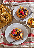 Bundt cake with fresh berries and chocolate icing