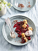 Ice cream dessert with morello cherries and sponge cubes