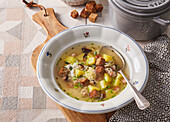 Potato soup with bacon, egg and garlic croutons