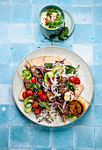 Souvlaki skewers with tzatziki, rice and vegetables