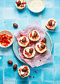 Cupcakes with coconut, strawberries and chocolate eggs