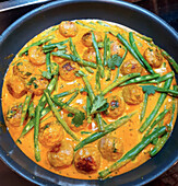 Yellow Thai curry with pork meatballs