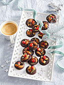 Chocolate thalers with nuts and candied fruit
