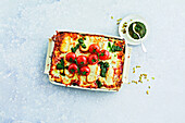 Halloumi lasagne with tomatoes and pesto