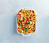 Sweet potato and chips casserole with Bolognese, feta and mint
