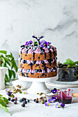 Naked cake with blackberry buttercream