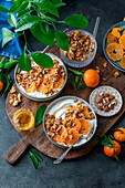 Yoghurt granola bowl with clementines