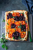 Puff pastry tart with pumpkin and beetroot roses