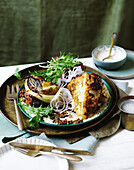 Roasted tandoori cauliflower with cashew yoghurt and lentil salad