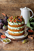Naked cake with pistachio cream and figs
