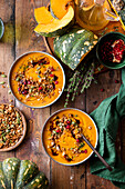 Pumpkin soup with savoury granola and pomegranate seeds
