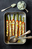 Baked carrots stuffed with goat's cheese and parsley