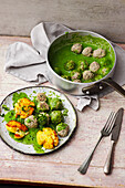 Green Königsberger meatballs with crushed potatoes