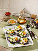 Baked purple jacket potatoes with Gouda cheese